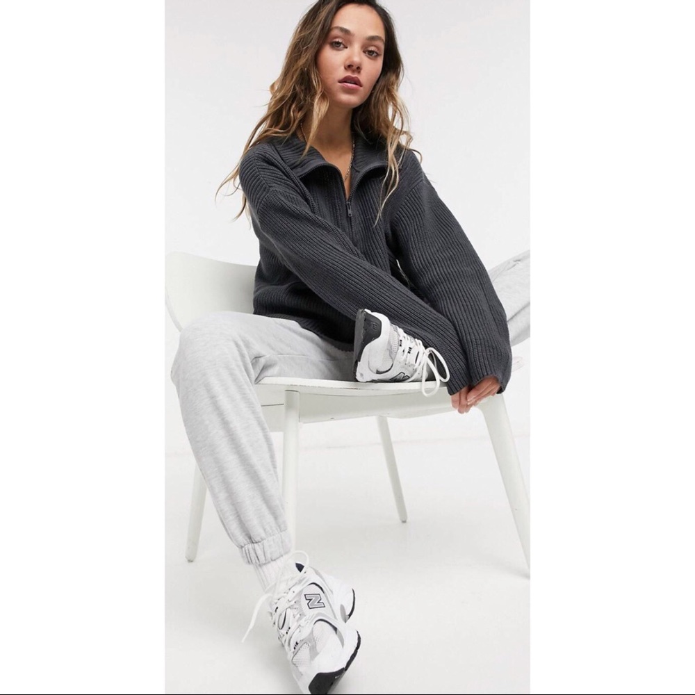 Knitted sweater with zipper funnel neck